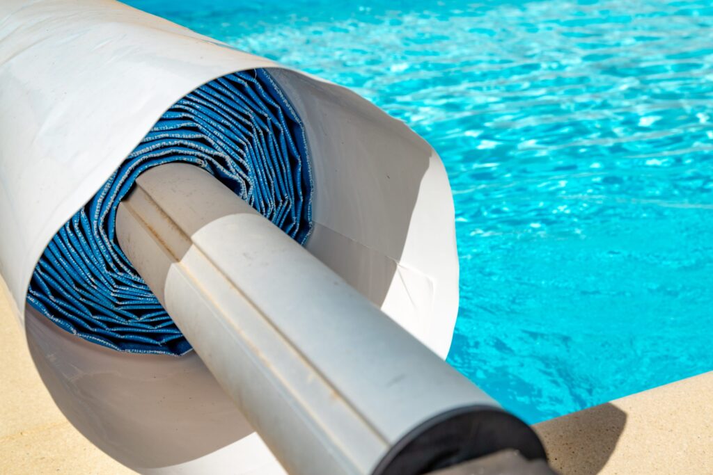 pool cover on the edge of a pool during the summer