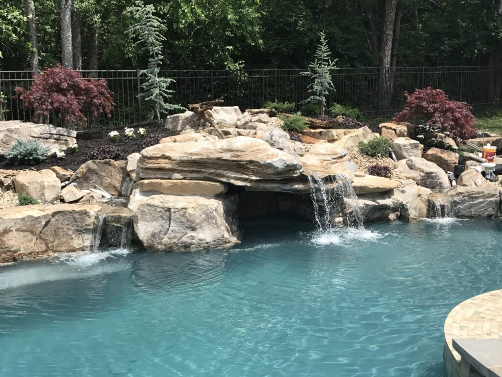pool waterfalls: pros, cons, and everything you need to know by peek pools & spa