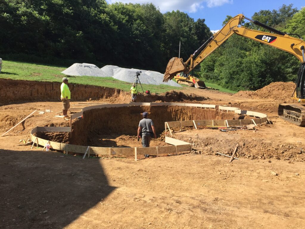 peek pools provides the information you need to know about pool construction for a hilly backyard.